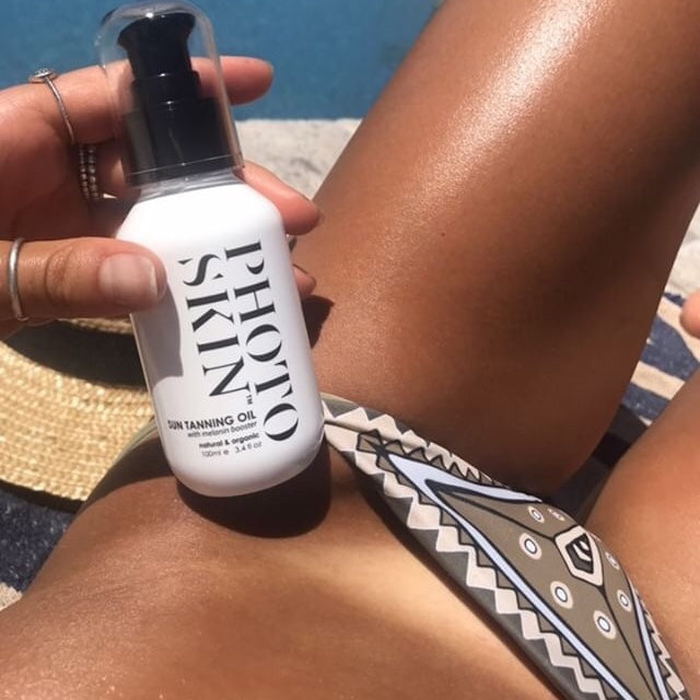 Photoskin sun tanning oil with tan lines